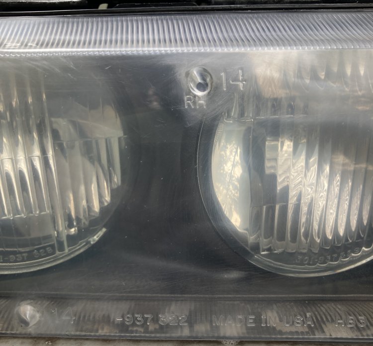 A closeup of my headlight after wet-sanding; there sre still some noticable scratches along the top of the housing