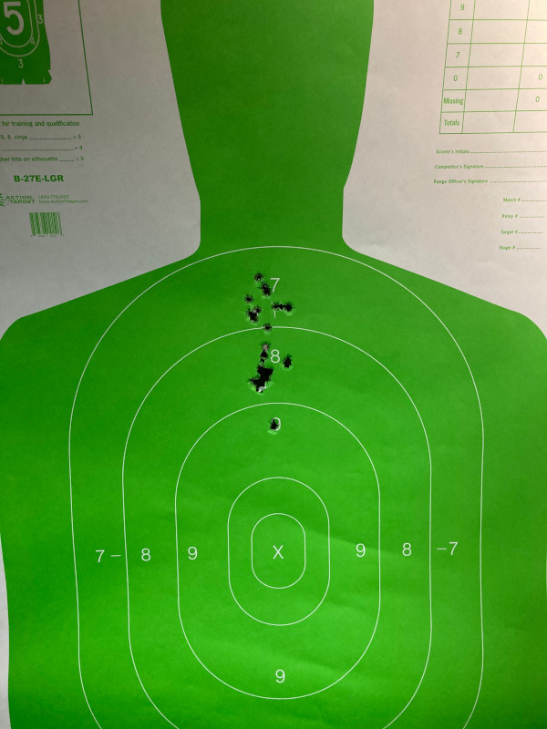 A target I shot with a CZ-75; 10 rounds are closely grouped around the 7 marker of the target, 10 rounds are closely grouped around the 8 of the target, one round hit the 9 of the target